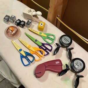 Scrapbook scissors and cut out shape tools and a paper cutter with templates